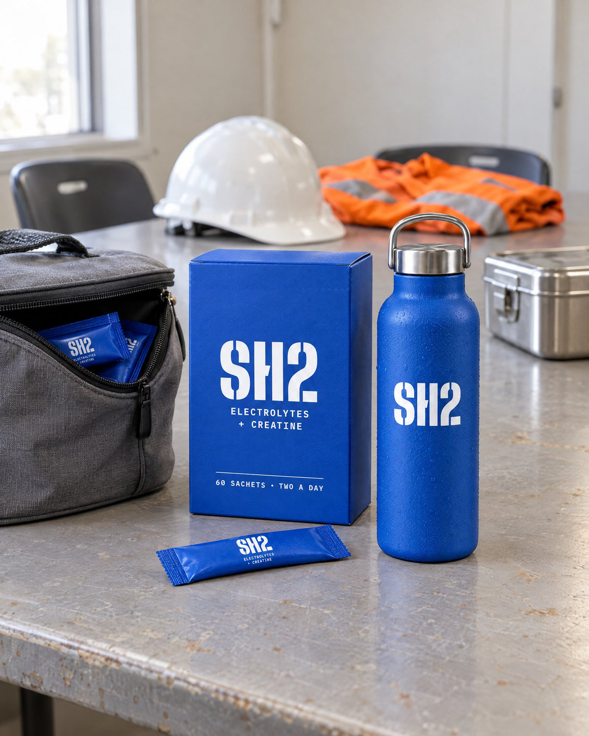 SH2 box, bottle and sachets on a crib-room table at smoko