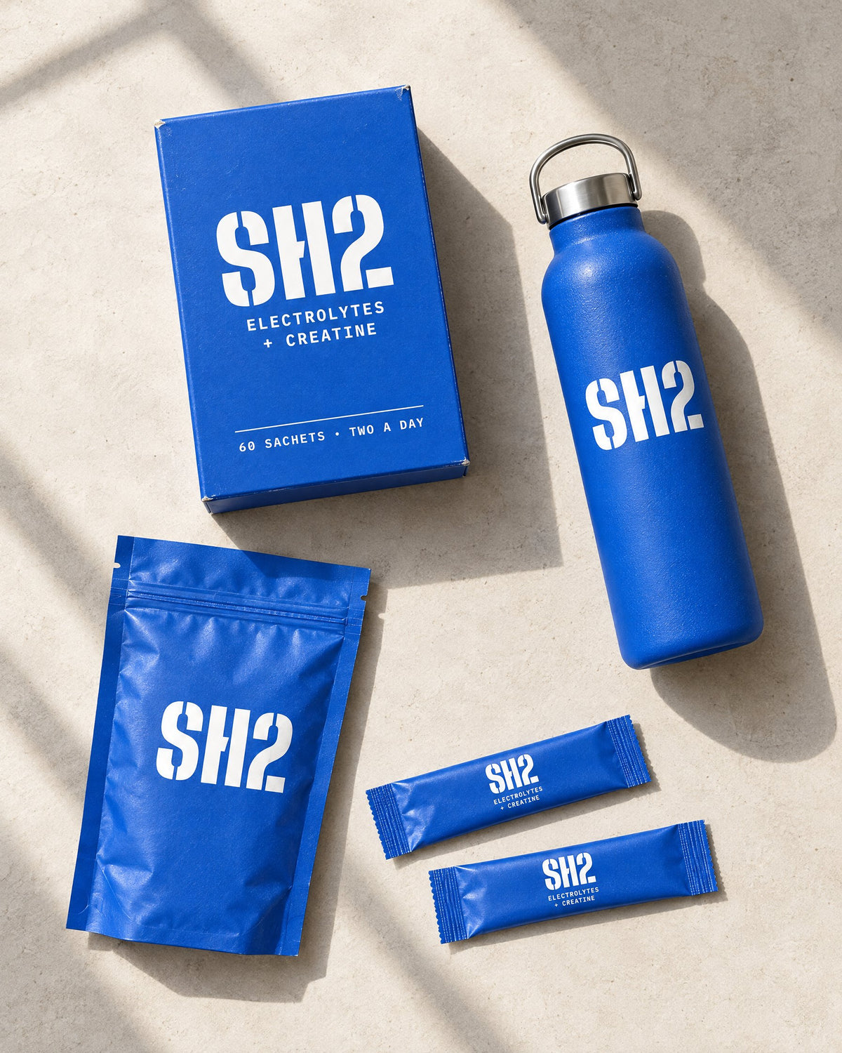 SH2 starter kit from above: box, bottle, zip pouch and two sachets