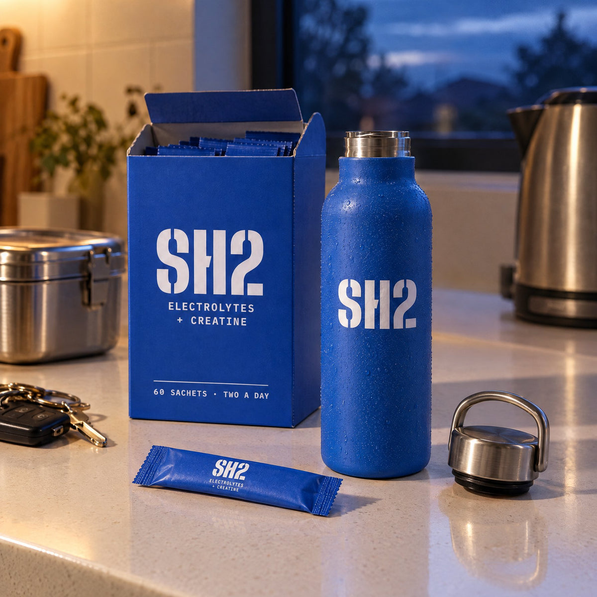 SH2 box, bottle and a sachet on a kitchen bench before work