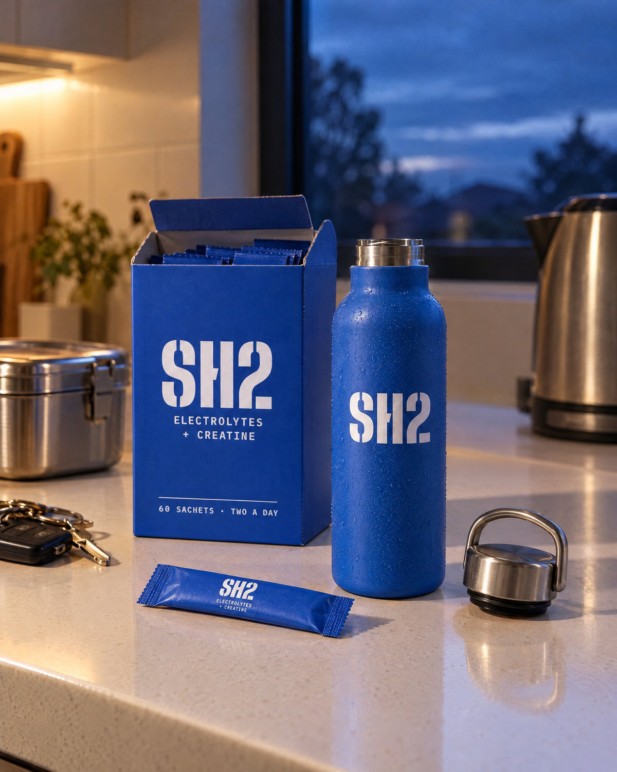 SH2 box, bottle and a sachet on a kitchen bench at 4:45 am